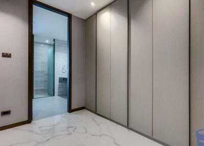 Modern hallway with built-in storage and tile flooring