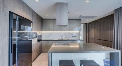 Modern kitchen with island and built-in appliances