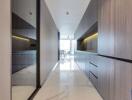 Modern hallway with sleek storage cabinets and glass partition