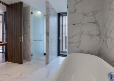 Modern bathroom with bathtub and glass shower