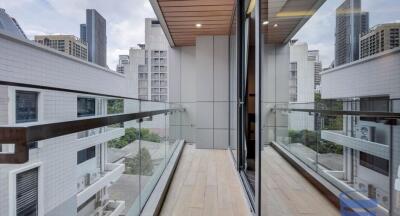 Modern balcony with city view and glass railings