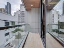 Modern balcony with city view and glass railings