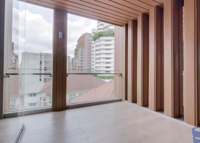 Modern balcony with wooden paneling and city view