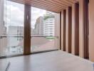 Modern balcony with wooden paneling and city view