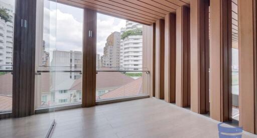 Modern balcony with wooden paneling and city view