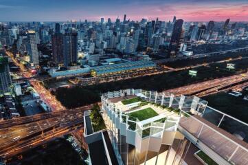 Rooftop view of cityscape at sunset