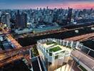 Rooftop view of cityscape at sunset