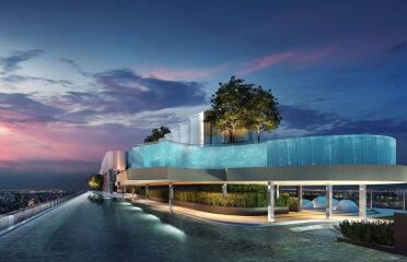 Modern building exterior with rooftop pool at sunset