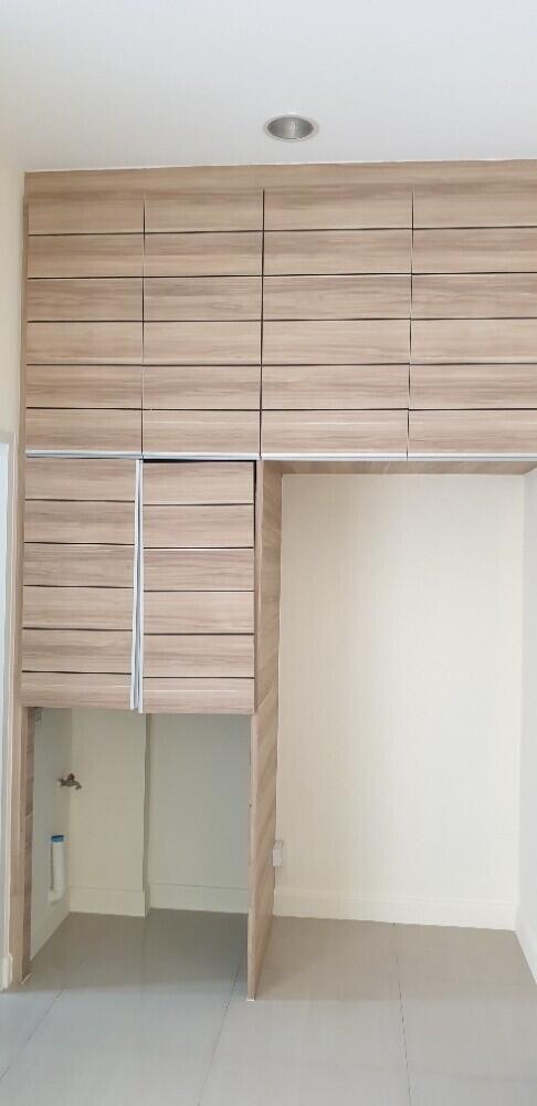 Modern utility room with built-in cabinets