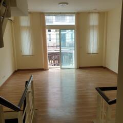 Bright and spacious living room with large windows