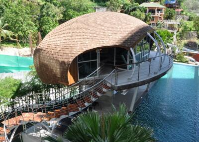 Unique contemporary building with pool and greenery