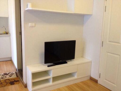 Living room with TV unit and shelving