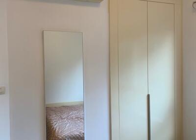 Bedroom with mirror and air conditioning