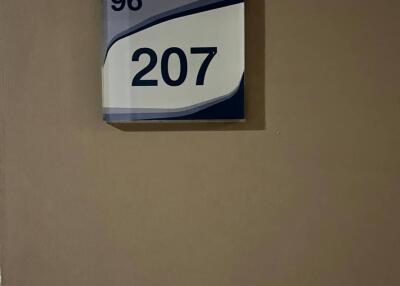 Room number 207 on a door