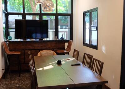 Dining room with modern furnishings and large windows