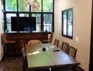 Dining room with modern furnishings and large windows