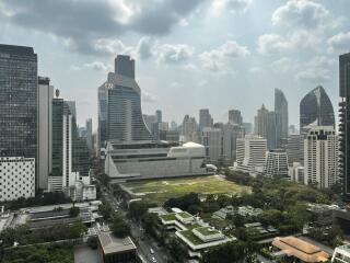 City skyline with a mix of modern skyscrapers and green spaces