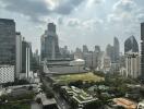 City skyline with a mix of modern skyscrapers and green spaces