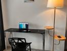 Home office with desk and floor lamp