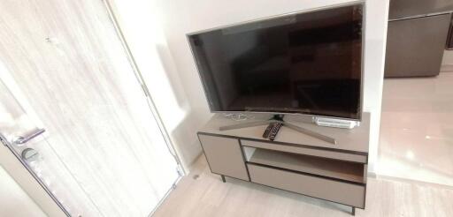 Television on a modern stand in a bright living room