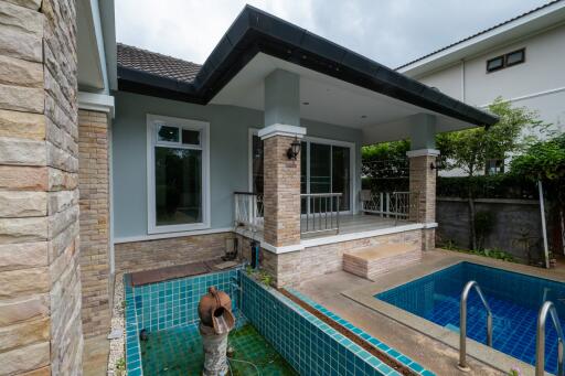 backyard with covered patio and swimming pool