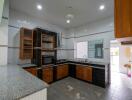 Modern kitchen with wooden cabinets and granite countertops