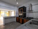 Spacious kitchen with modern appliances and ample natural light