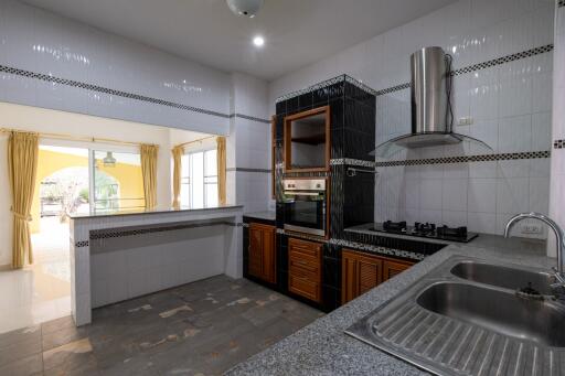 Spacious kitchen with modern appliances and ample natural light