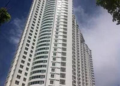 High-rise apartment building under blue sky