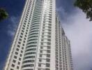 High-rise apartment building under blue sky