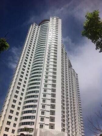 High-rise apartment building under blue sky