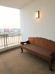 Balcony with wooden bench and city view