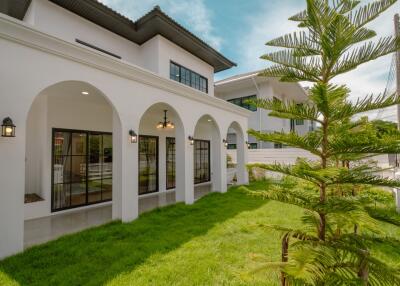 Spacious backyard with patio and large windows