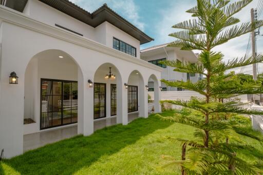 Spacious backyard with patio and large windows