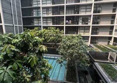 Photo of an apartment building with a swimming pool