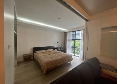 Modern bedroom with large window and sliding partition