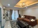 Modern living room with brown sofa and geometric rug