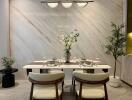 Modern dining room with marble accent wall and elegant table setup