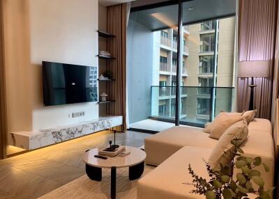 Modern living room with a sectional sofa and a balcony view