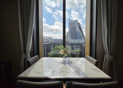 Dining area with a marble table and city view