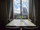 Dining area with a marble table and city view