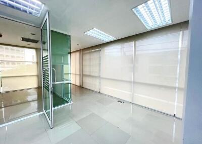 Modern office space with glass partitions and ample natural light