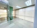 Modern office space with glass partitions and ample natural light