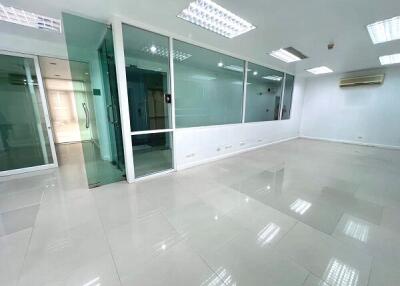 spacious office area with glass partition