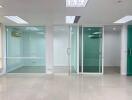 Modern office space with glass partitions and bright lighting