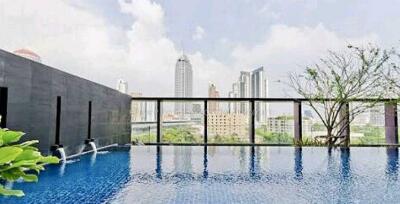 Outdoor infinity pool with city skyline view