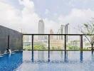 Outdoor infinity pool with city skyline view