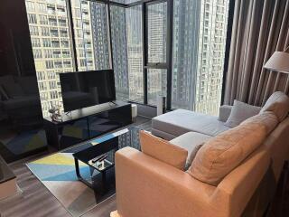 Modern living room with a large window and city view