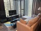 Modern living room with a large window and city view