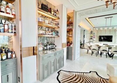 Spacious living area with zebra rug and built-in shelves